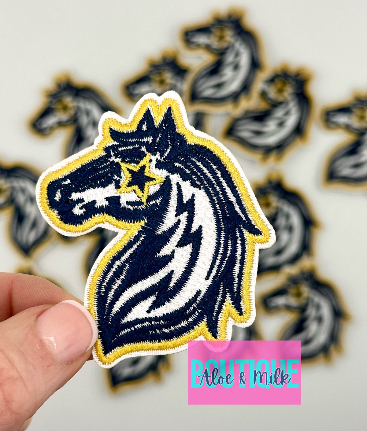 Mascot Mustang, team patches