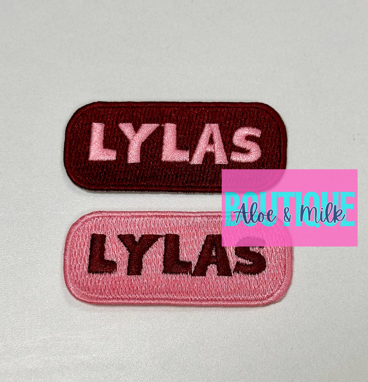 LYLAS Pink on Maroon