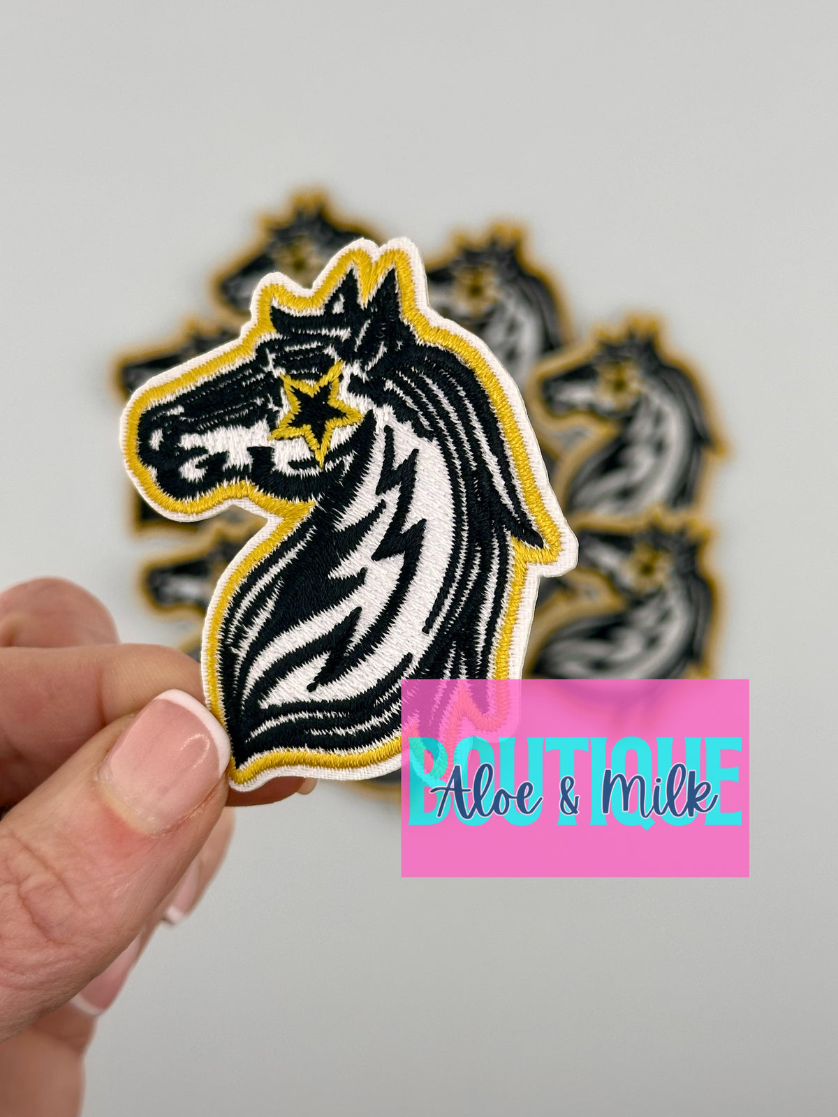 Mascot Mustang, team patches